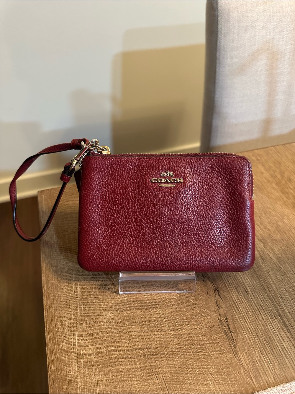 Coach Pebbled Leather Wristlet in Deep Red with Gold Logo